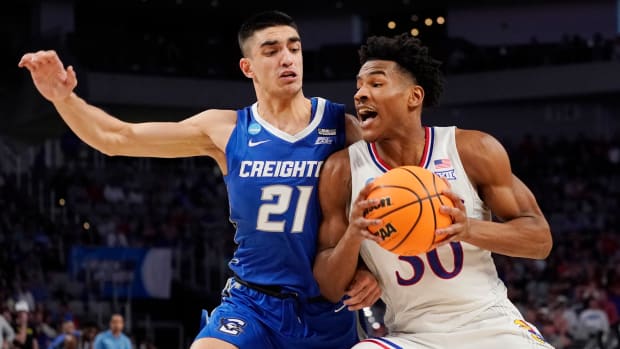 Mar 19, 2022; Fort Worth, TX, USA; Kansas Jayhawks guard Ochai Agbaji (30) drives against Creighton Bluejays guard Rati Andronikashvili (21) during the second round of the 2022 NCAA Tournament at Dickies Arena. Mandatory Credit: Chris Jones-USA TODAY Sports
